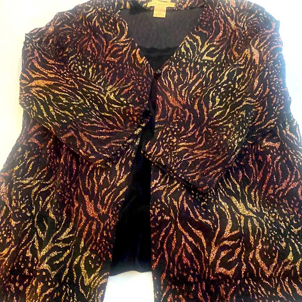 Glittery sweater with black under shell. One piece.